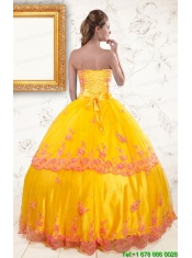 2015 Exquisite Strapless Gold Quinceanera Dresses with Appliques