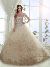 Beautiful Beaded Bodice and Ruffled Brush Train Quinceanera Dress in Champagne