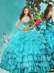 Elegant Halter Top Aqua Blue Quinceanera Dress with Ruffled Layers and Beading