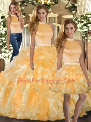 Vintage Halter Top Sleeveless Quinceanera Gown Floor Length Beading and Ruffles Gold Organza