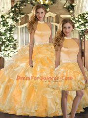 Vintage Halter Top Sleeveless Quinceanera Gown Floor Length Beading and Ruffles Gold Organza