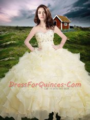 Best Selling Sleeveless Floor Length Beading and Ruffled Layers Lace Up Quinceanera Gown with Light Yellow