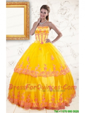 2015 Exquisite Strapless Gold Quinceanera Dresses with Appliques